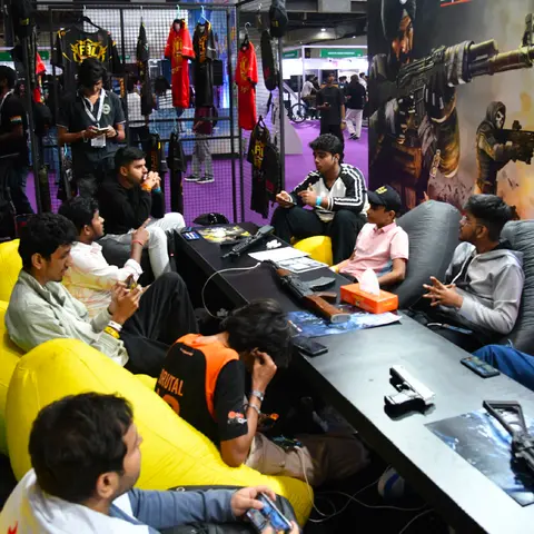 Gamers at PCs in a convention gaming zone